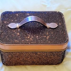 Beautiful rose gold cosmetic bag a with shimmering sparkle color.